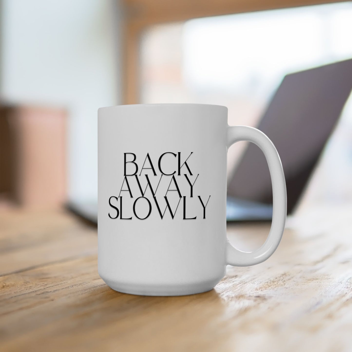 15oz Back Away Slowly ceramic coffee mug desk view